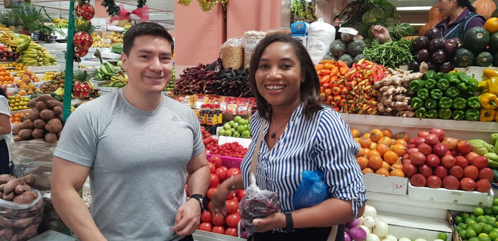 Monique standing with Vendor at Mercado Central