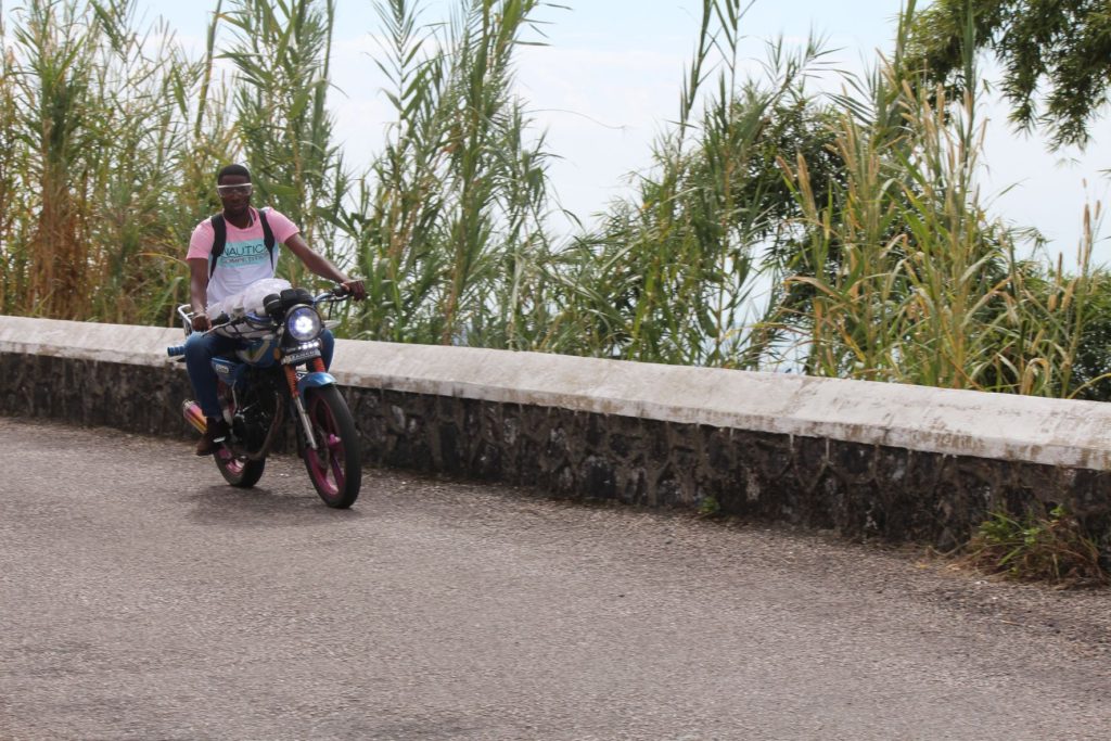 Man riding bike on New Castle Main Road- Blue Mountains - Jamaica