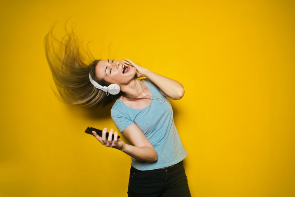 Woman having fun listening to music