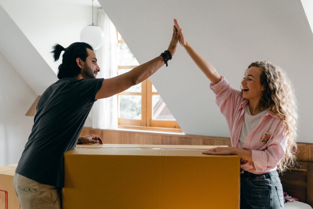 happy couple decluttering home