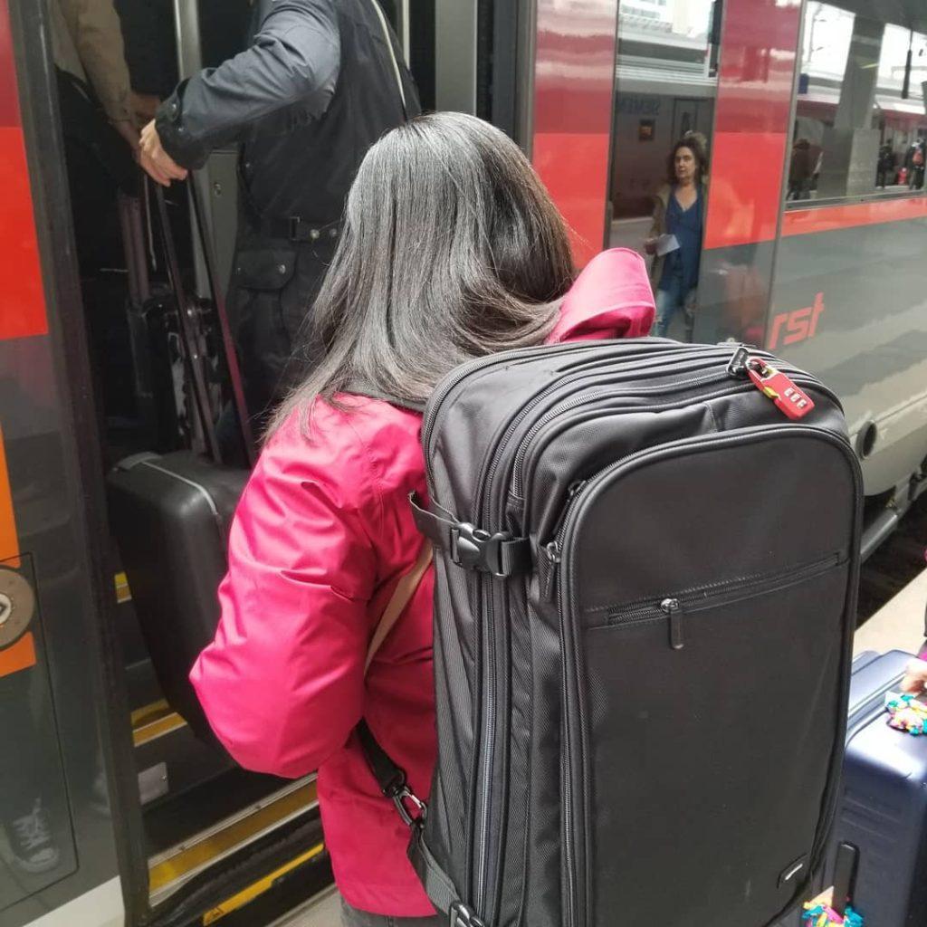 Monique Abbott carrying backpack at Vienna Haupbahnhof Train Station, Vienna, State of Vienna, Austria.