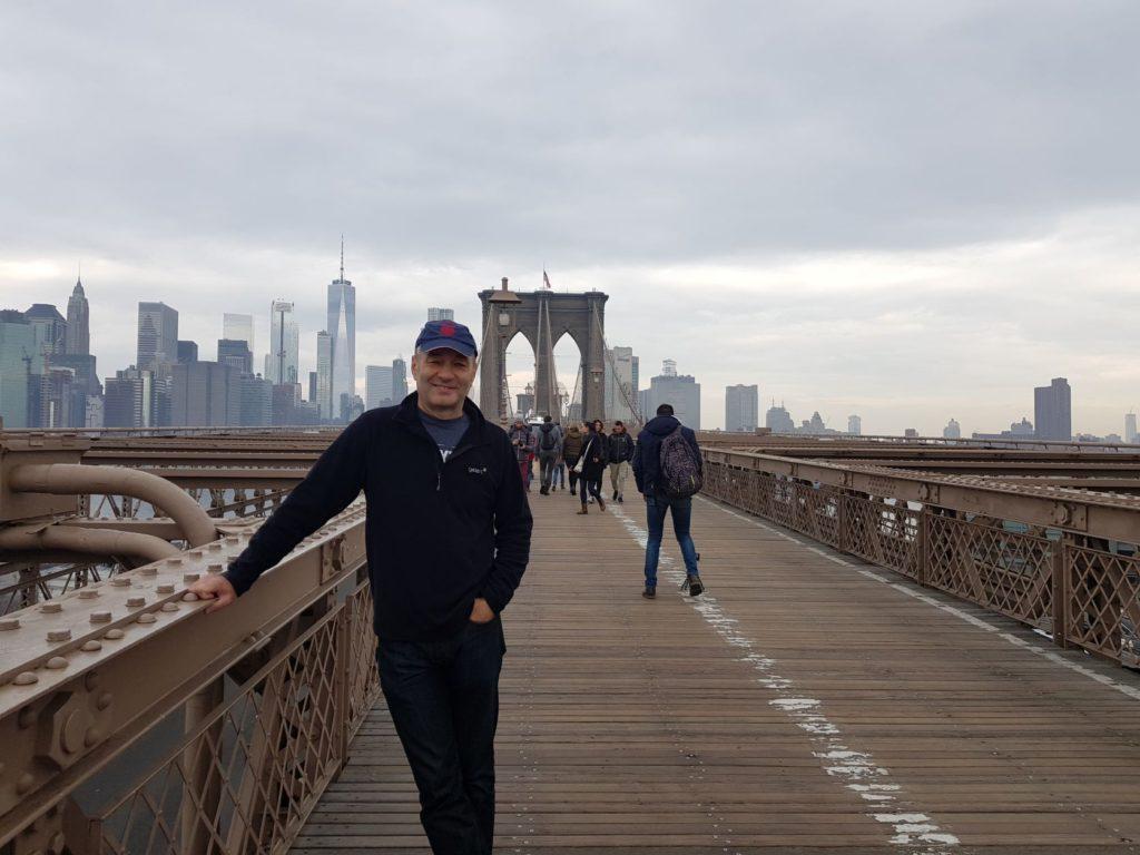 Nick Abbott standing on the Brooklyn Bridge, New York