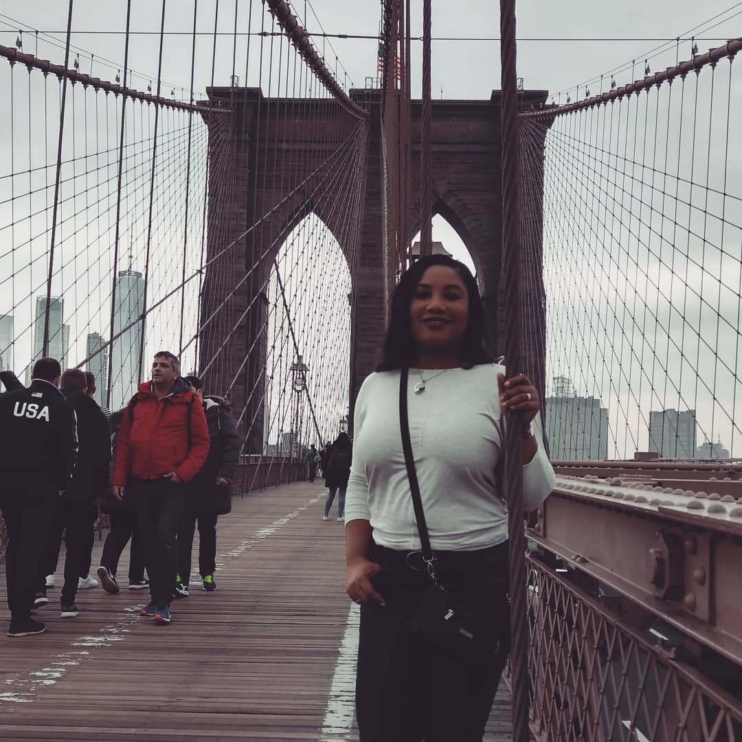 Monique Abbott standing on the Brooklyn Bridge, New York