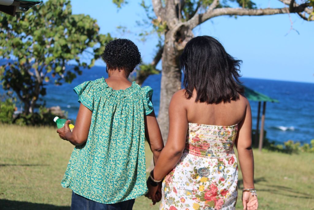 Monique Abbott walking with her mother at Robin's Bay, St. Mary, Jamaica