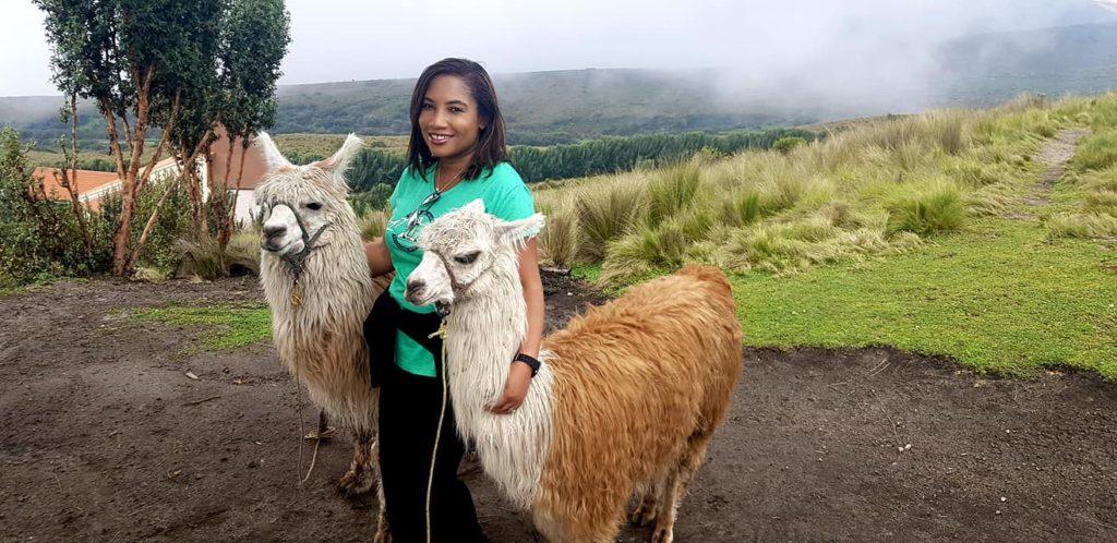 Monique Abbott standing with 2 llamas in Rucu Pichancha, Quito, Ecuador