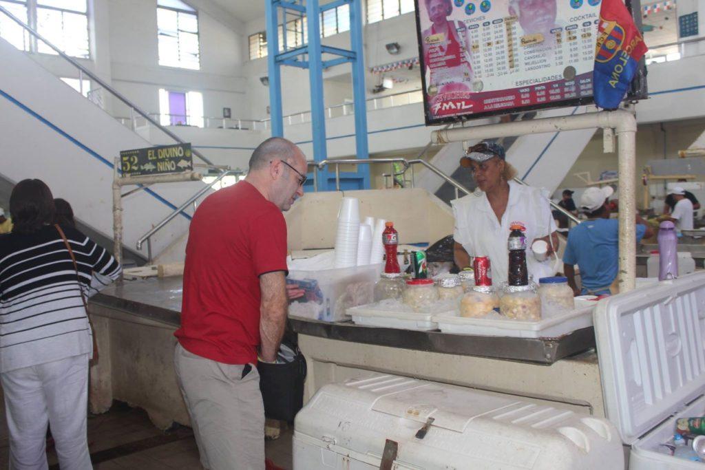 Nick Abbott purchasing ceviche at Mercado de Mariscos (Seafood Market), Panama