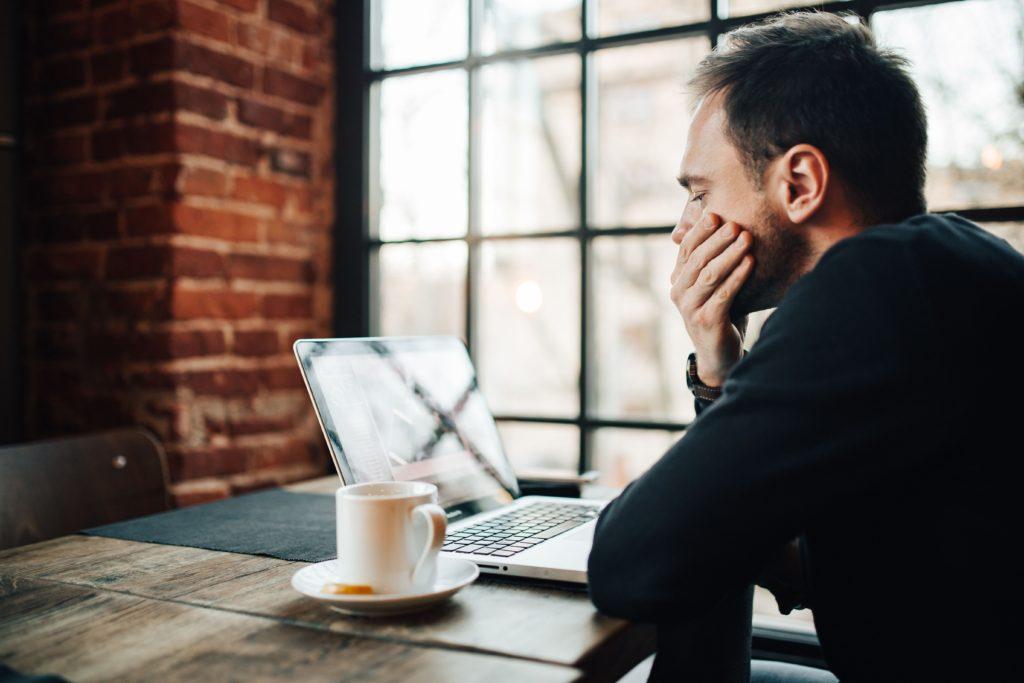 Man looking at laptop screen