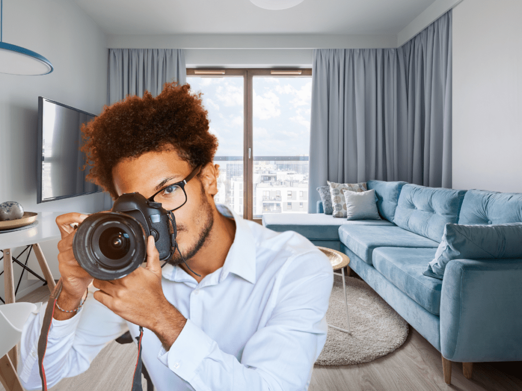 Photographer taking pictures of living room