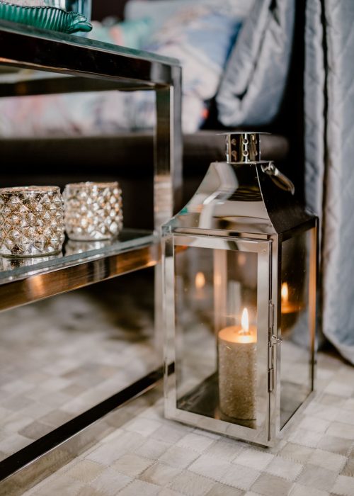 Decorative lantern candle on living room floor